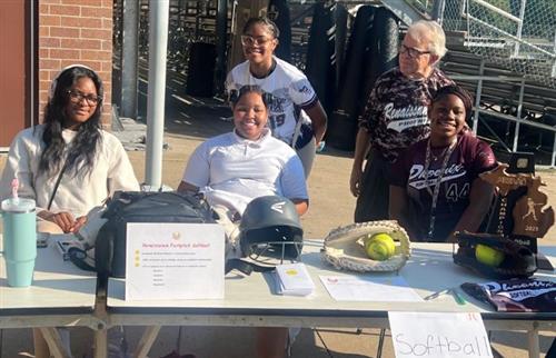 Softball team members posing